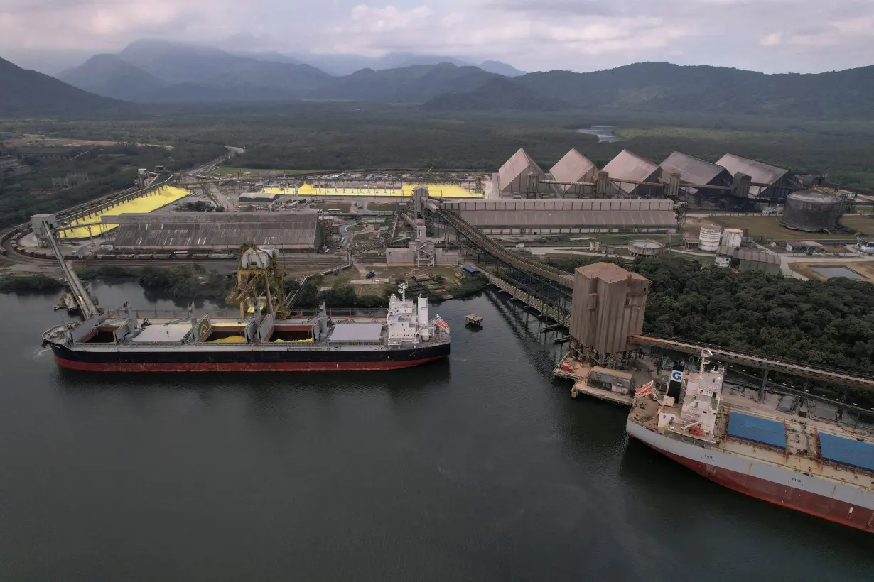 FILE PHOTO: Ships and warehouses containing grains and sugar are seen at Santos Port, in Santos