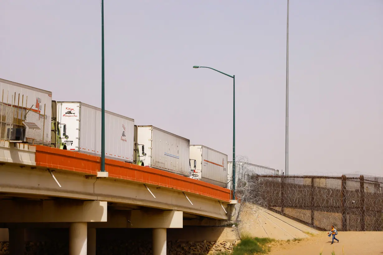 FILE PHOTO: Trucks queue to cross into the United States at Zaragoza-Ysleta border crossing