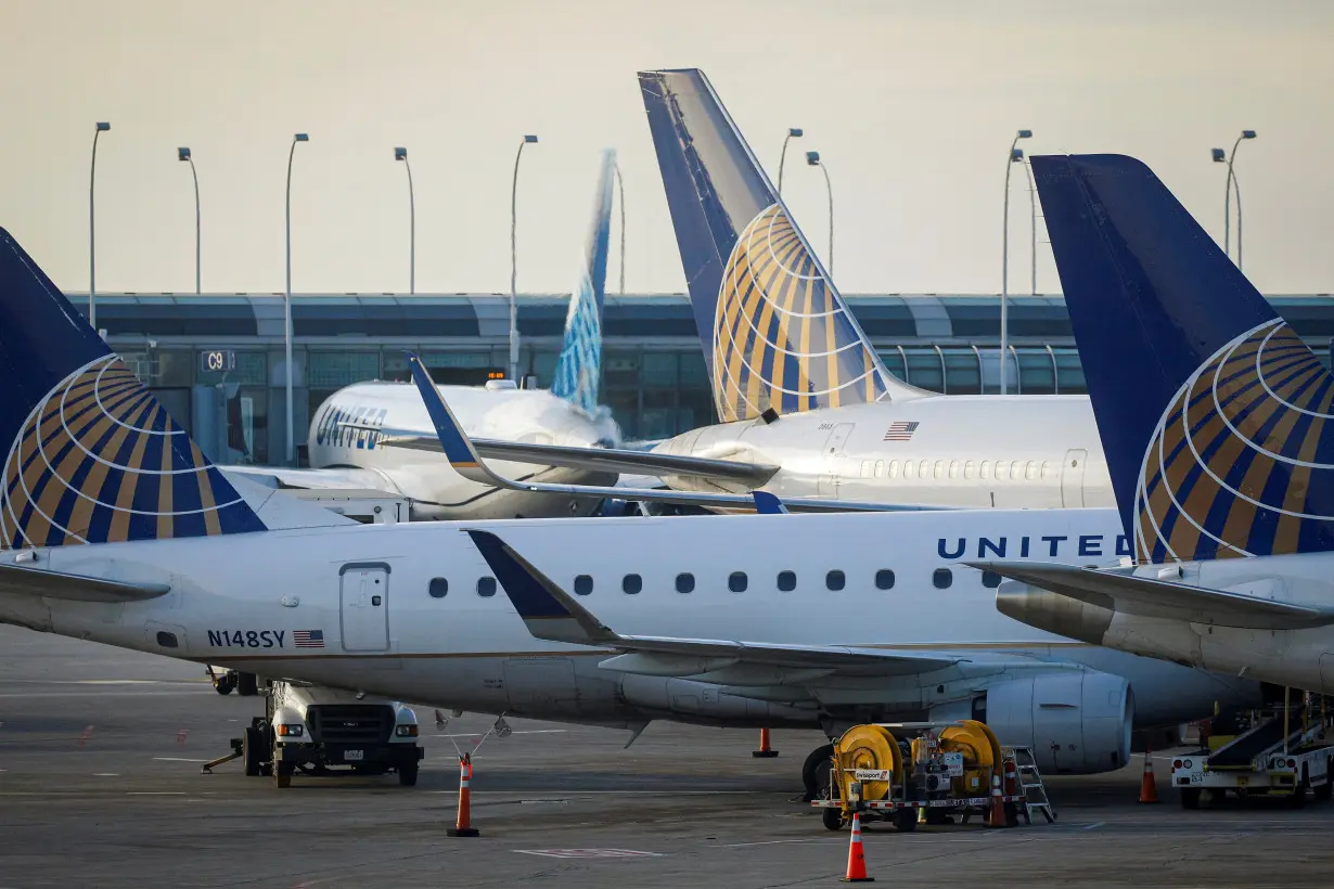 FILE PHOTO: United Airlines planes are parked at their gates at O'Hare International Airport in Chicago, Illinois