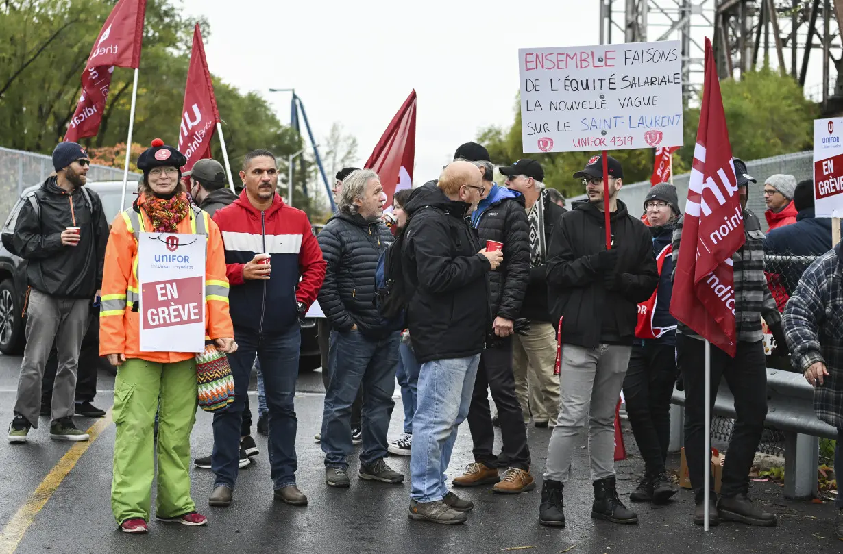 Strikers have shut down a vital Great Lakes shipping artery for days, and negotiations are looming