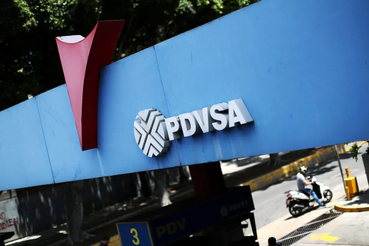 FILE PHOTO: A state oil company PDVSA's logo is seen at a gas station in Caracas