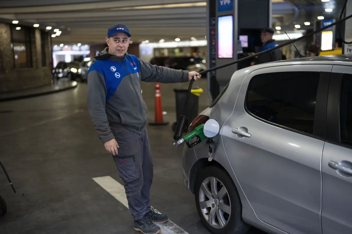 Drivers in Argentina wait in long lines to fill up the tanks as presidential election looms