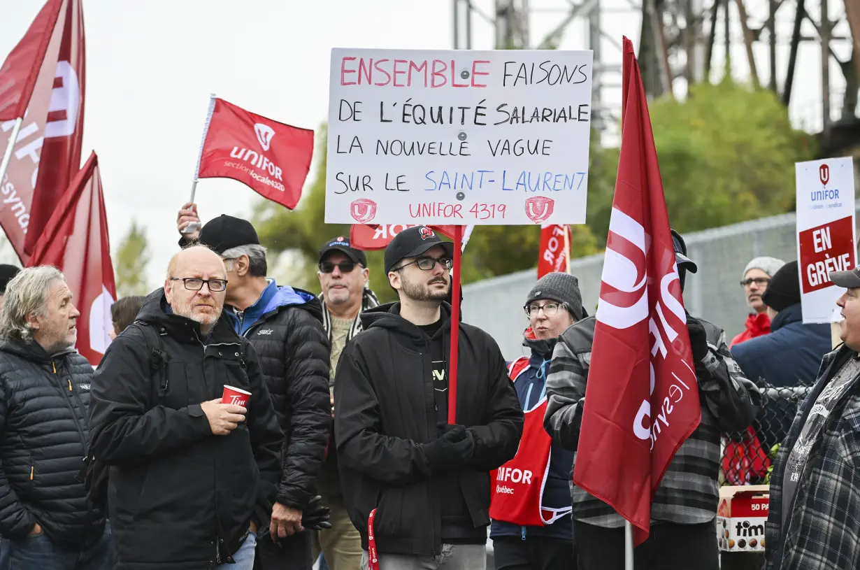 Strikers have shut down a vital Great Lakes shipping artery for days, and negotiations are looming