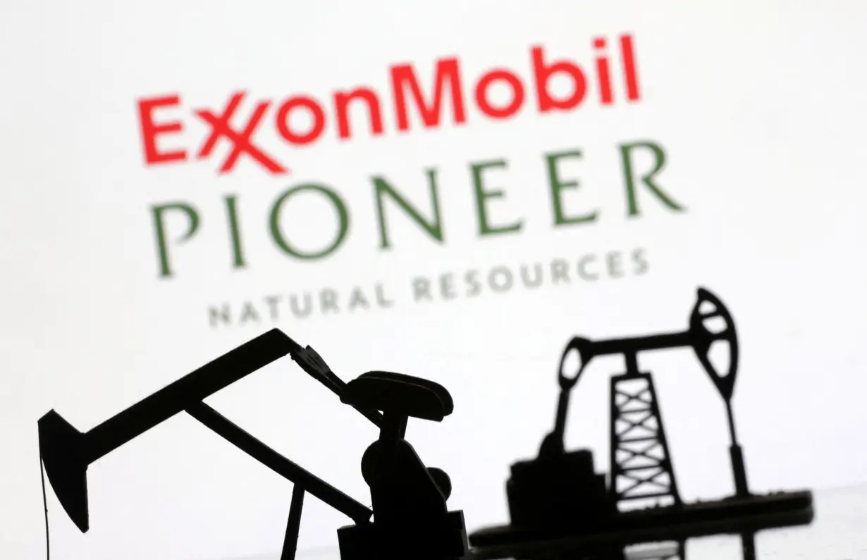 Illustration shows ExxonMobil and Pioneer Natural Resources logos