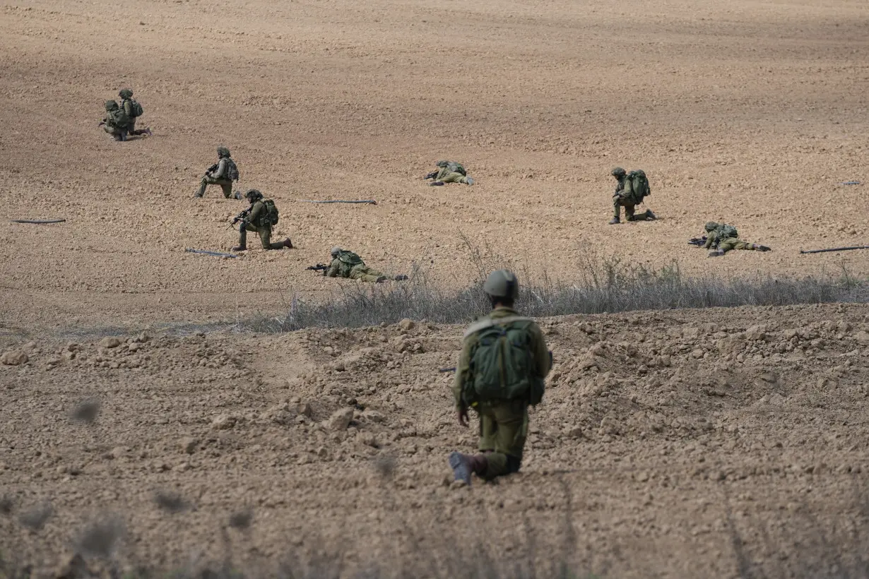 Israeli village near the Gaza border lies in ruin, filled with the bodies of residents and militants