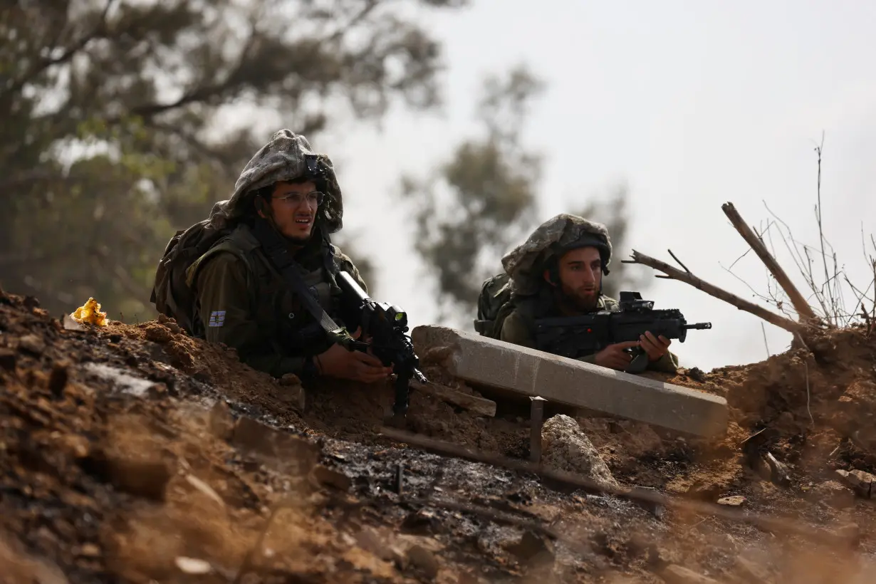 Israeli soldiers respond to an alert of an apparent security incident, in Ashkelon, southern Israel