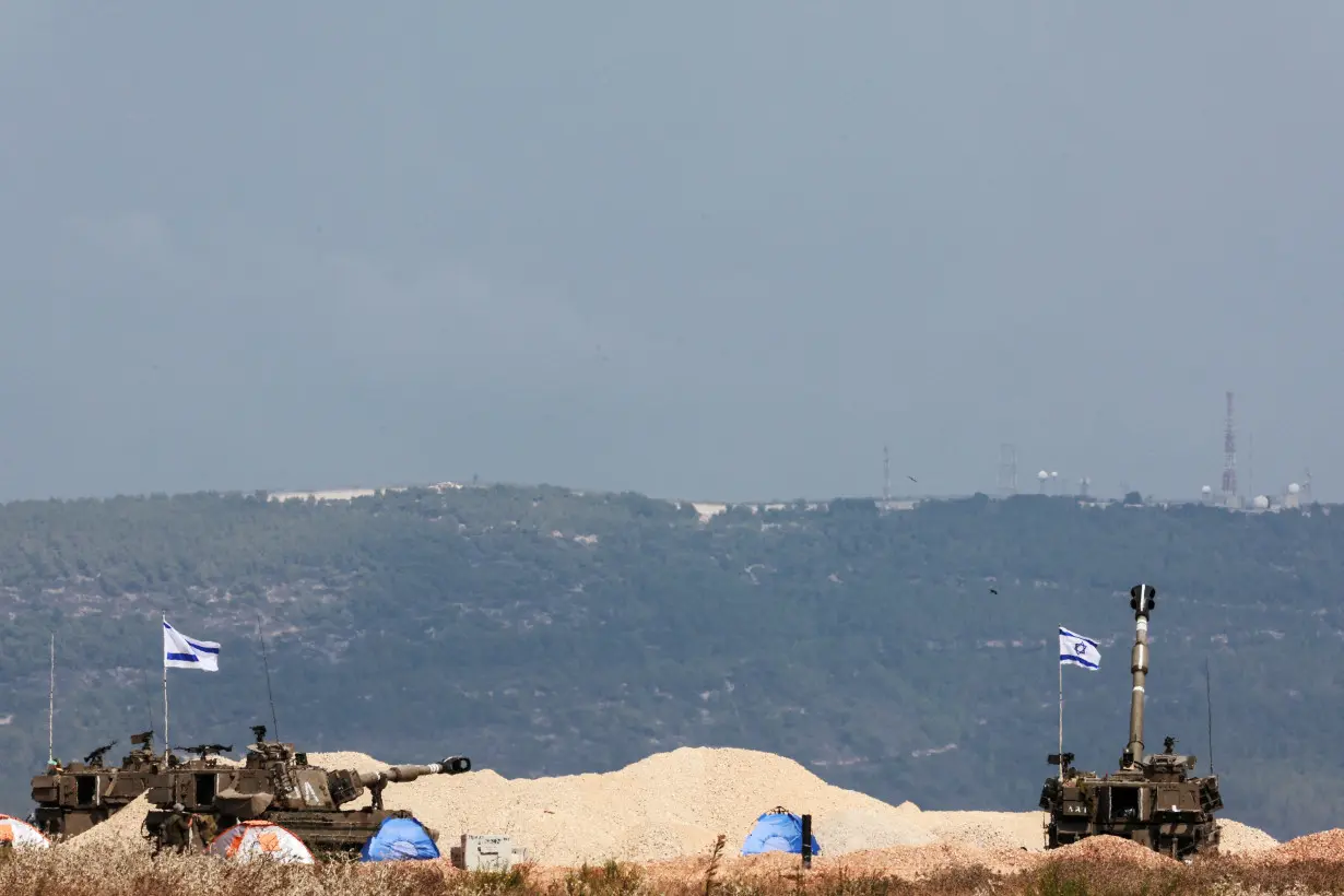 Israeli tanks are positioned near Israel's border with Lebanon, in northern Israel