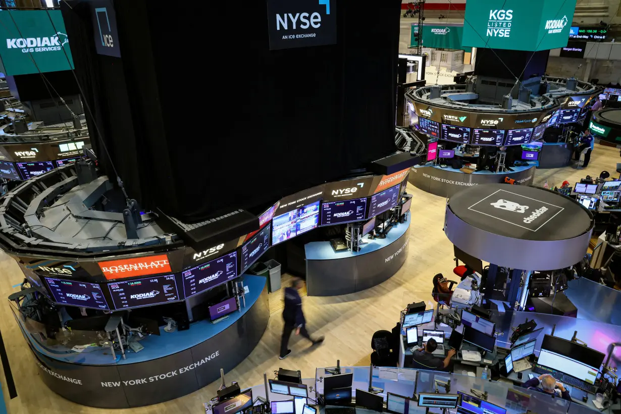 Traders work on the floor of the NYSE in New York