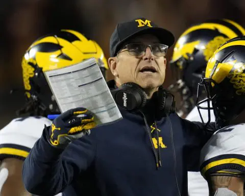 Tickets purchased in the name of suspended Michigan staffer to two SEC title games, AP source says