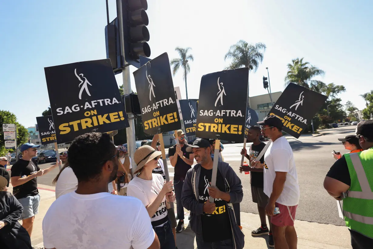 SAG-AFTRA members walk the picket line during their ongoing strike, in Los Angeles
