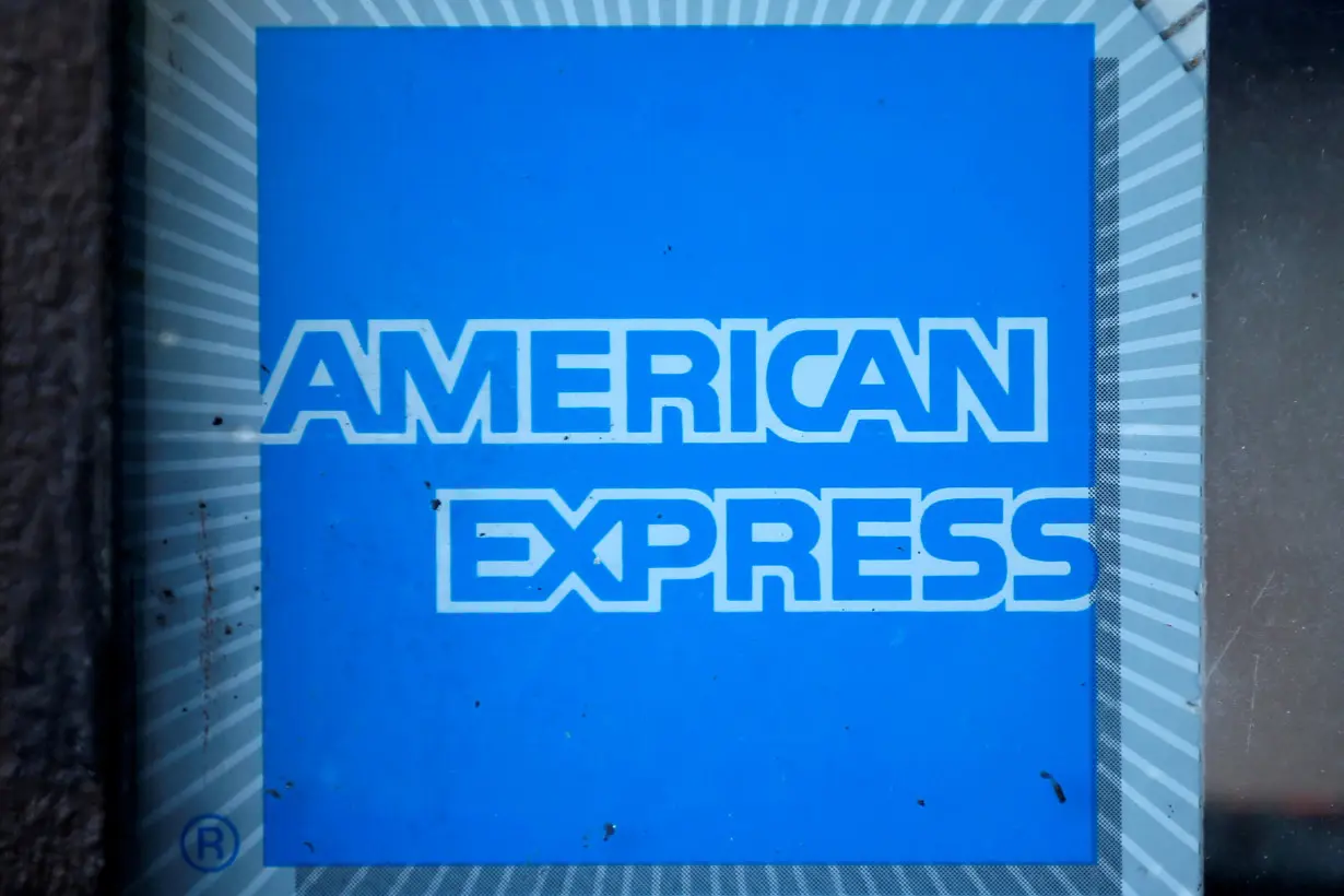 FILE PHOTO: The logo of Dow Jones Industrial Average stock market index listed company American Express (AXP) is seen in Los Angeles