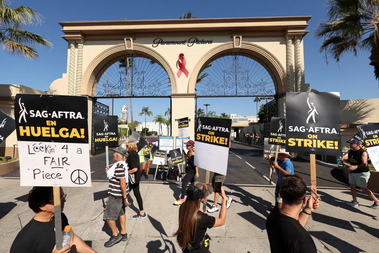 FILE PHOTO: SAG-AFTRA members walk the picket line during their ongoing strike, in Los Angeles