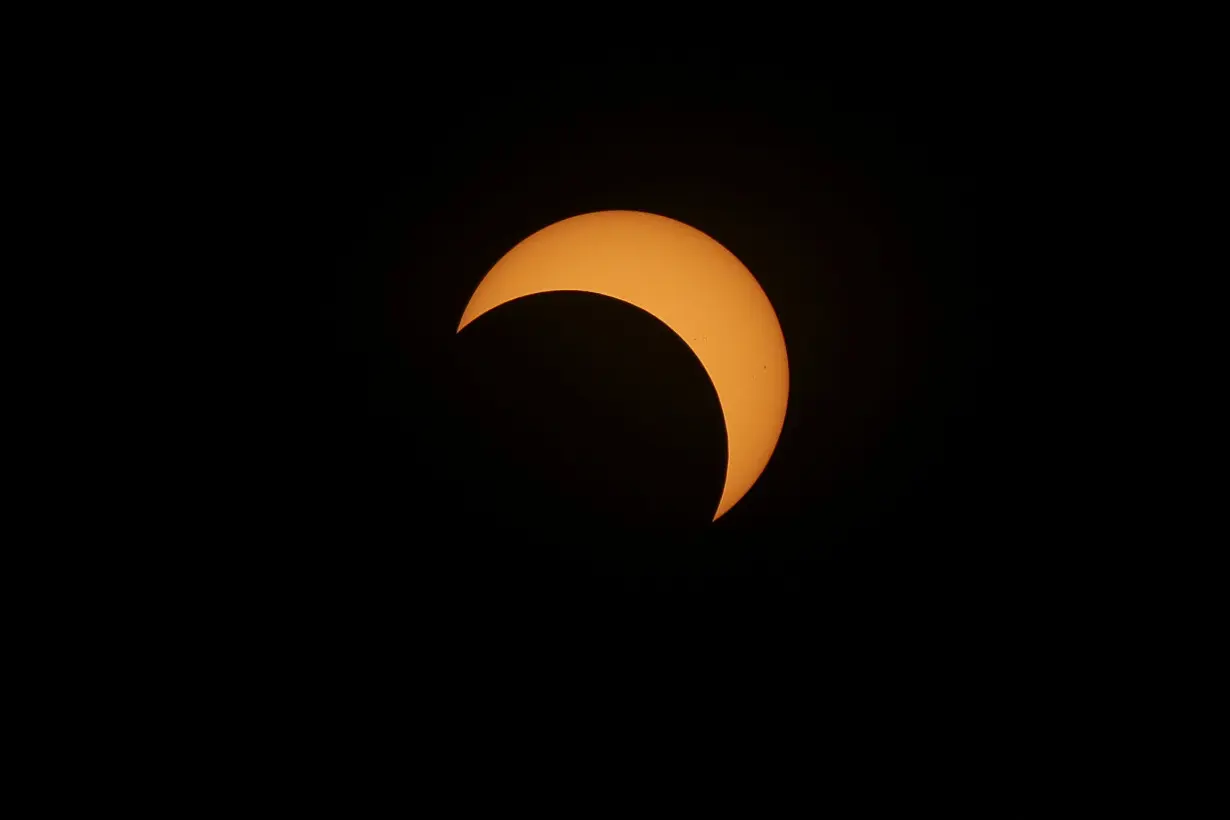 A solar eclipse is seen over Mexico