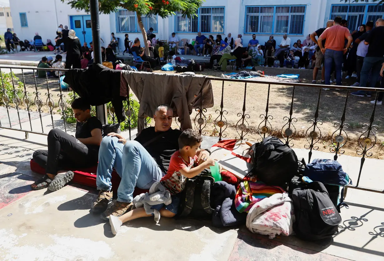 FILE PHOTO: Families of staff of international organisations shelter at a United Nations center