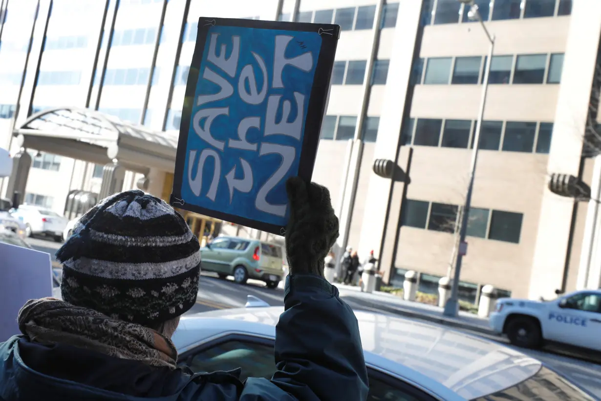 Net neutrality advocates rally in front of the Federal Communications Commission in Washington