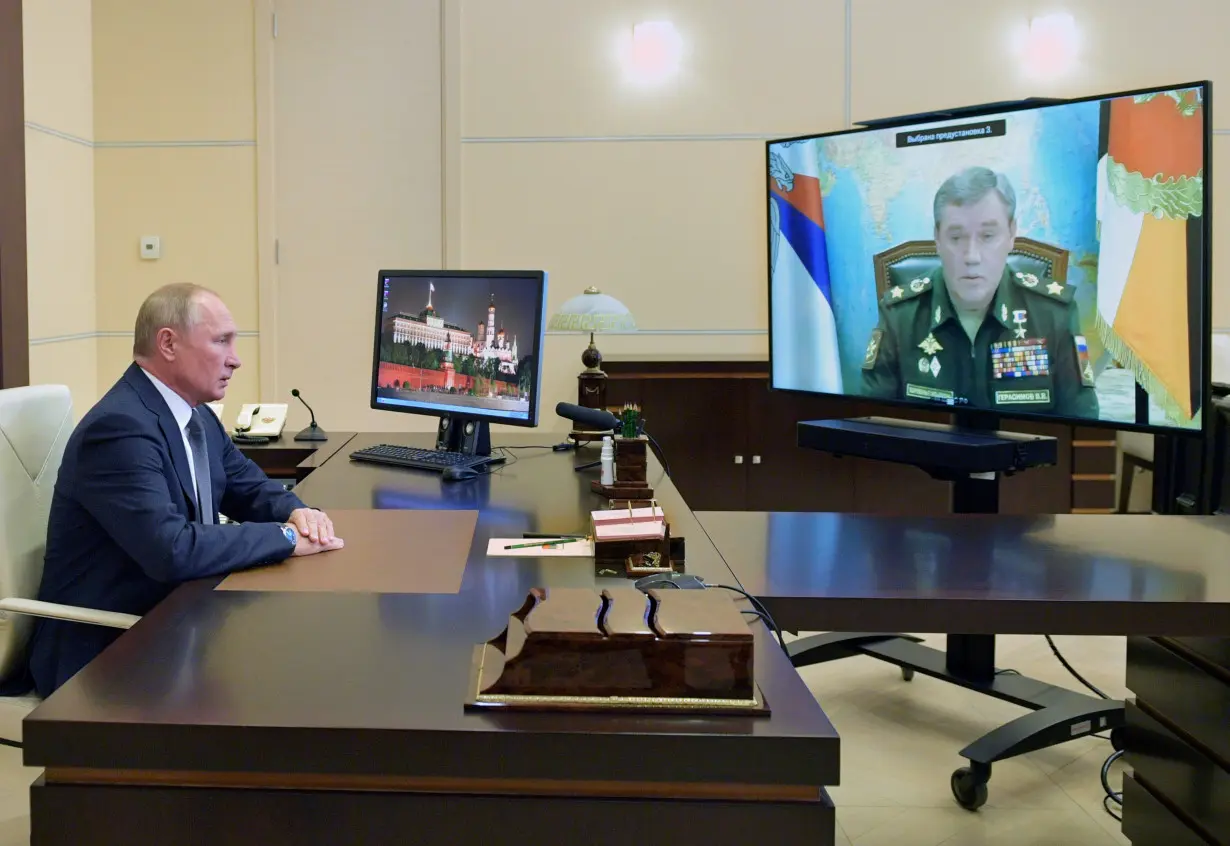 Russian President Putin meets with Chief of the Russian Armed Forces' General Staff Gerasimov via a video conference call, outside Moscow