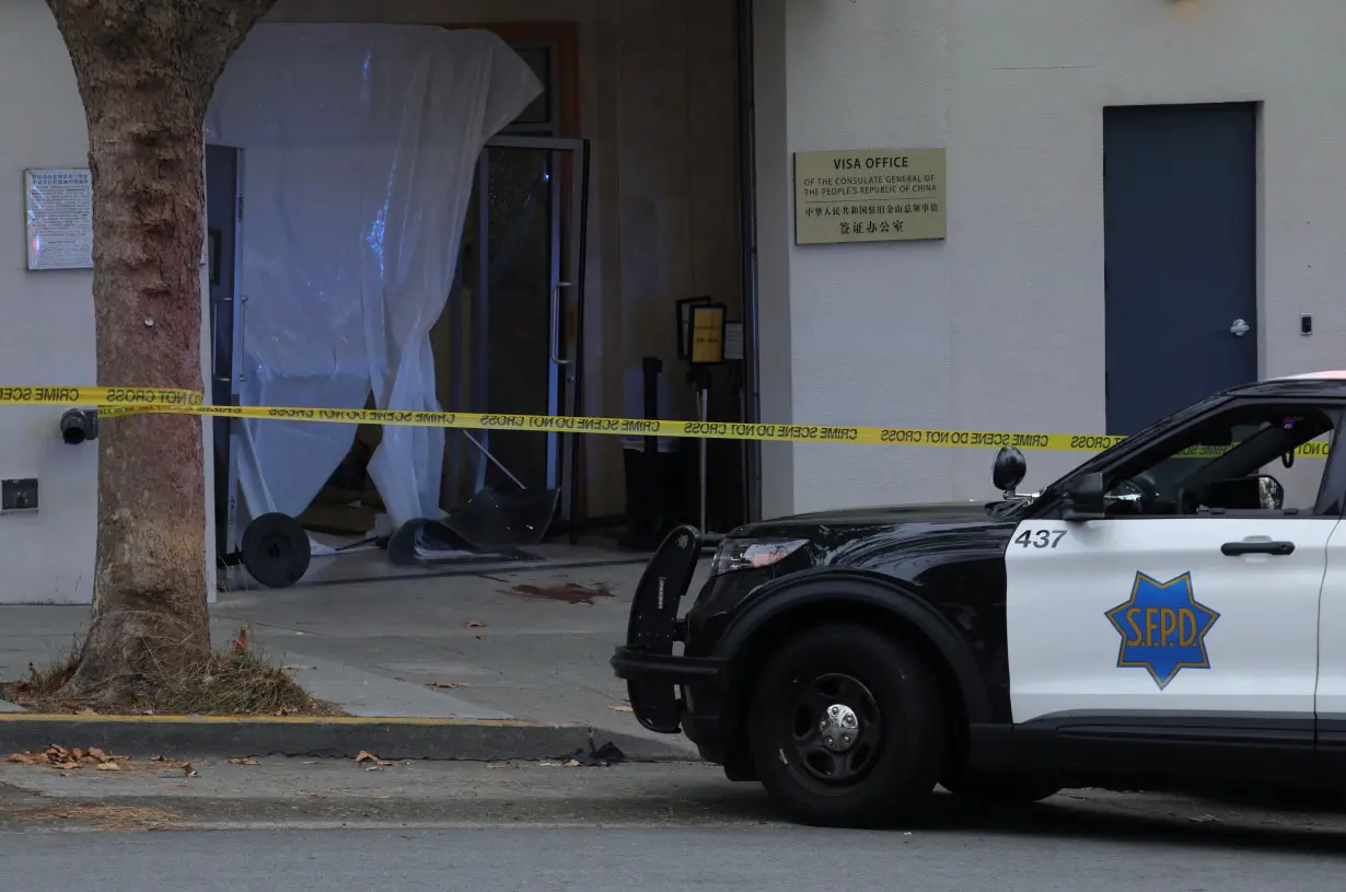 San Francisco Police vehicle is parked on the street near the visa office of the Chinese consulate, where local media has reported a vehicle may have crashed into the building, in San Francisco