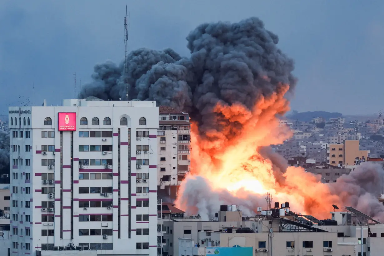 Smoke and flames billow after Israeli forces struck a high-rise tower in Gaza City