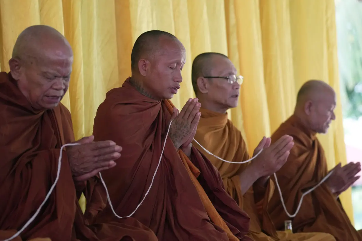 A modest Buddhist ceremony marks the anniversary of a day care center massacre in Thailand