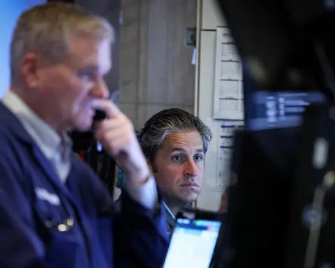 Wall St ends down slightly; investors await Friday's payrolls