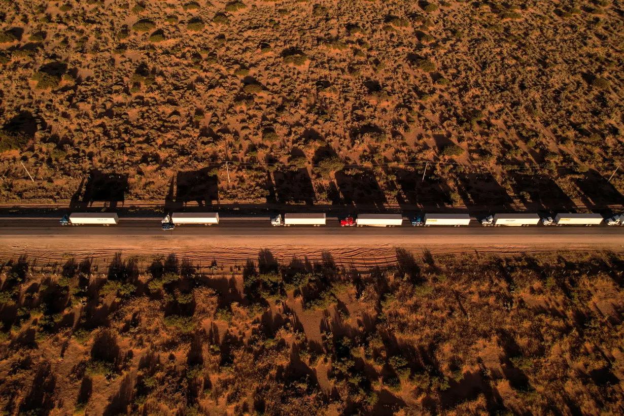 Trucks wait in a queue to cross into the United States via the Jeronimo-Santa Teresa International Bridge, in Ciudad Juarez