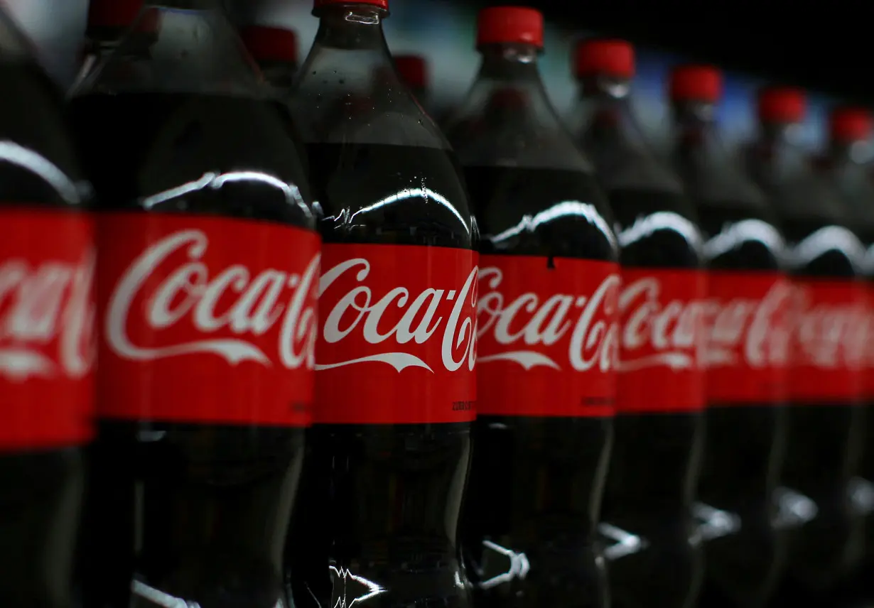 FILE PHOTO: Coca-cola soda is shown on display during a preview of a new Walmart Super Center prior to its opening in Compton, California,