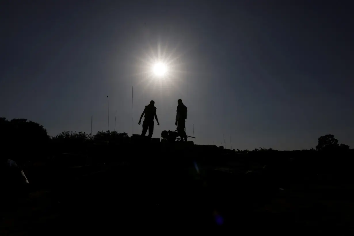 Israeli soldiers gather near Gaza Strip