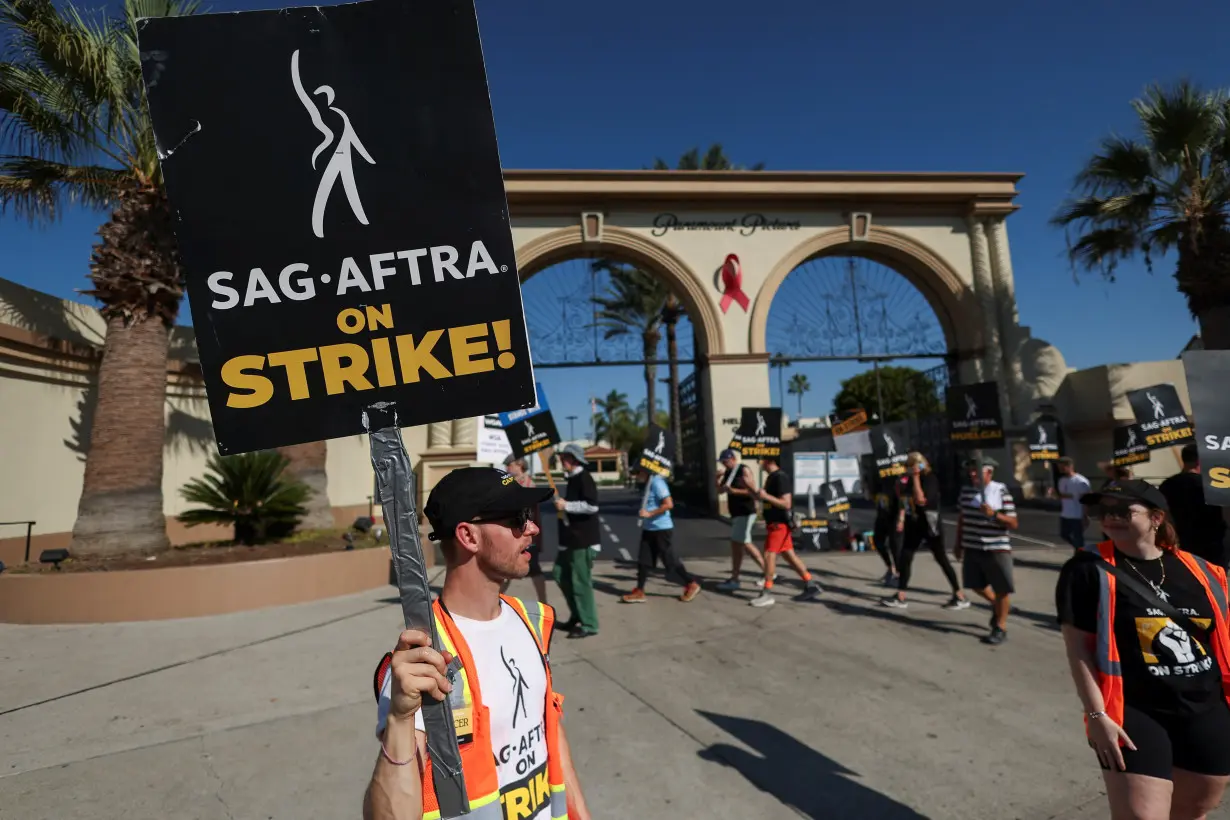 SAG-AFTRA members walk the picket line during their ongoing strike, in Los Angeles