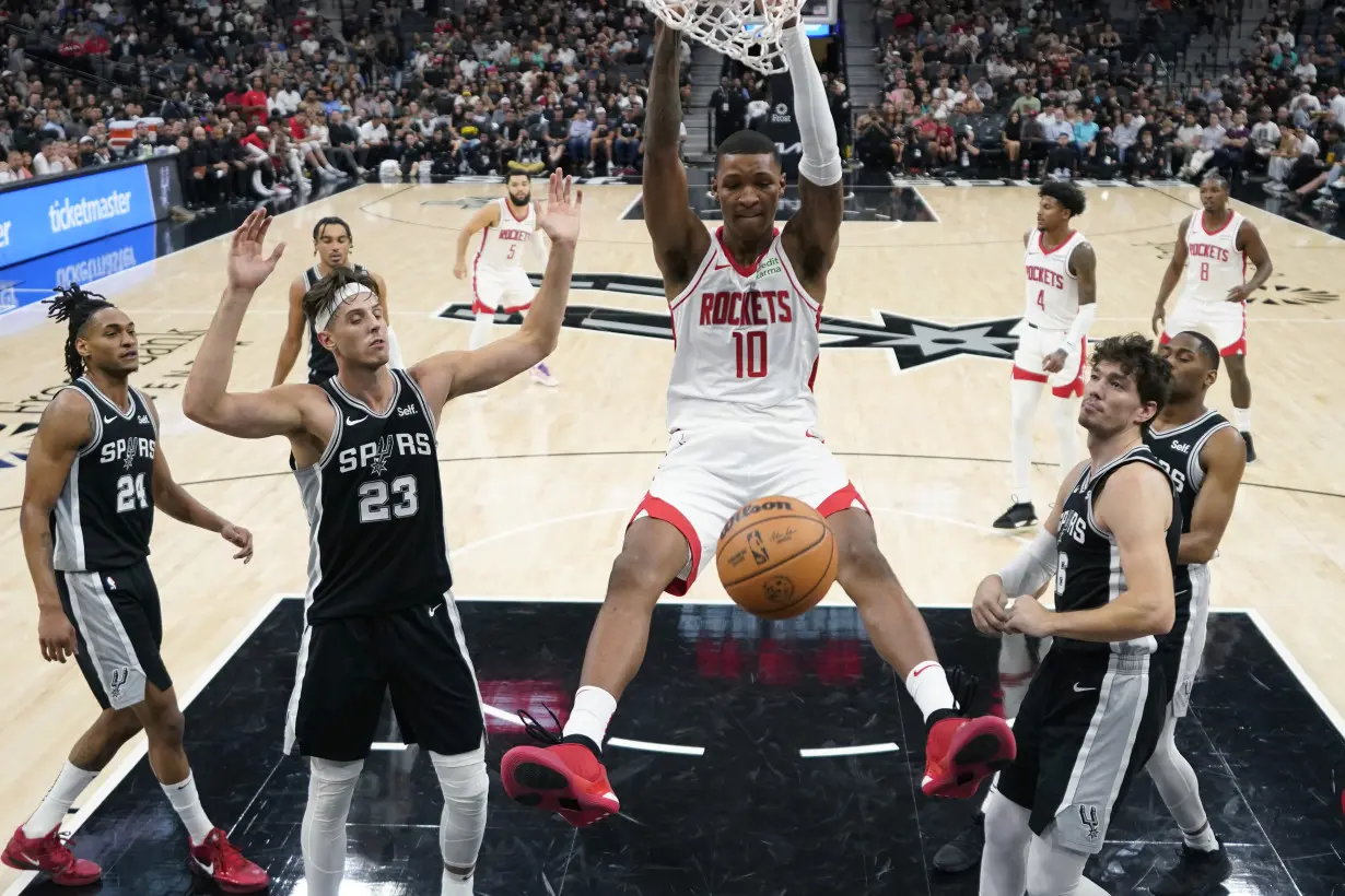 Wembanyama makes tying basket in regulation, then earns his first NBA win as Spurs top Rockets in OT