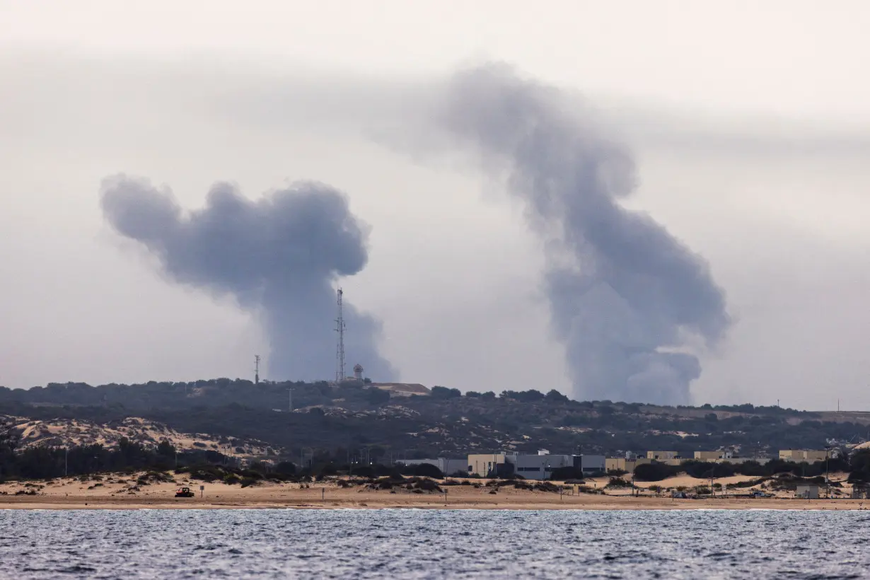 Smoke rises over Gaza, as seen from Israel's maritime border with Gaza