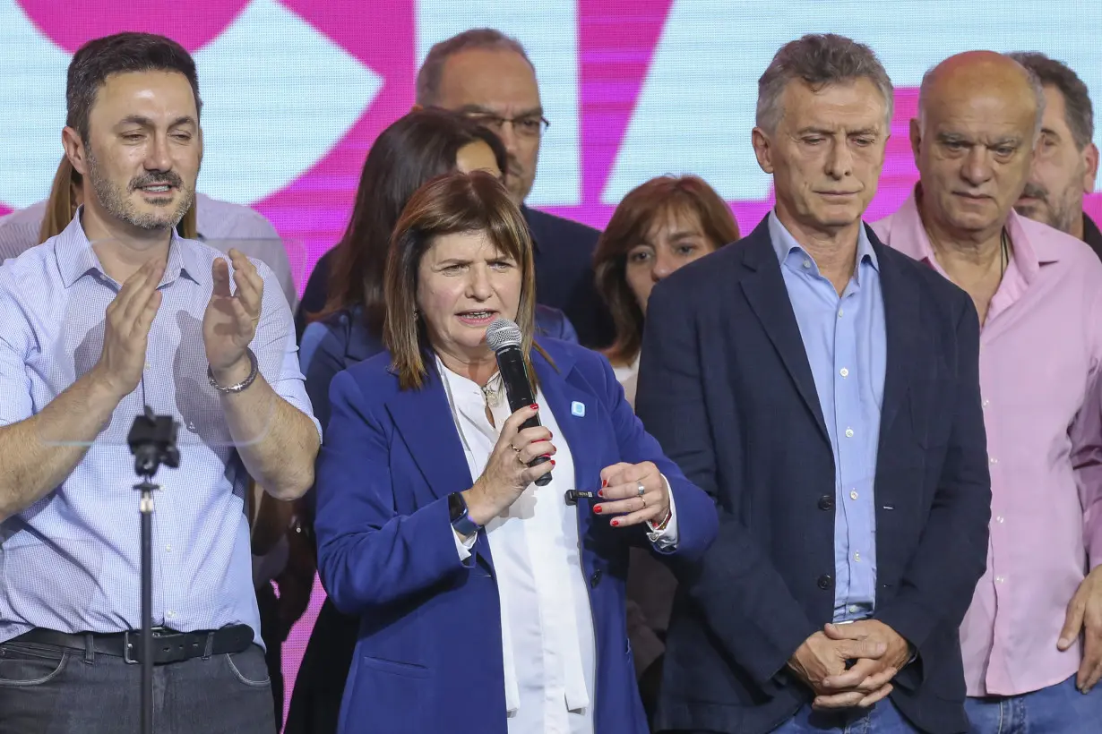 After presidential race surprise, Argentine economy minister and right-wing populist look to runoff