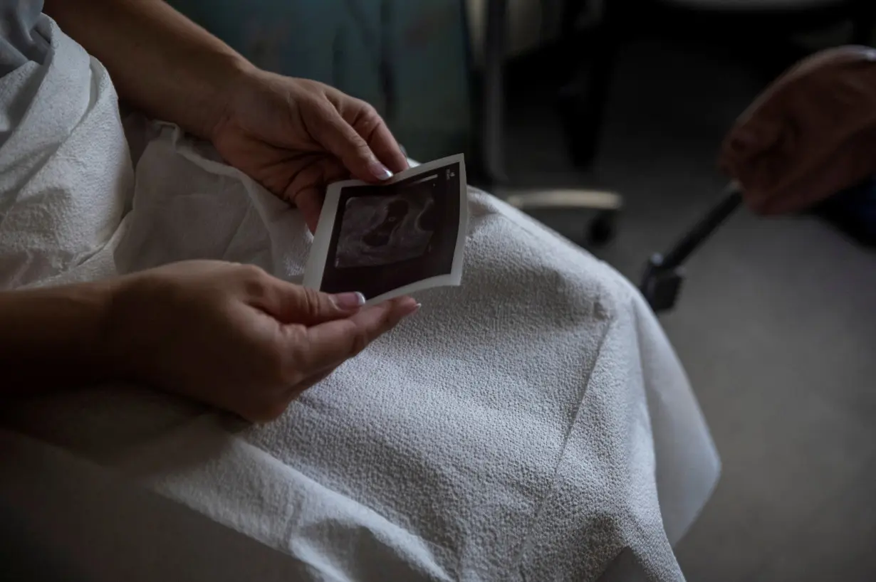 FILE PHOTO: A patient looks at her ultrasound before proceeding with a medical abortion at Alamo Women's Clinic in Albuquerque