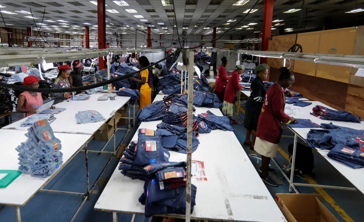 Kenyan workers check clothes made for export at the United Aryan EPZ factory in Ruaraka district of Nairobi