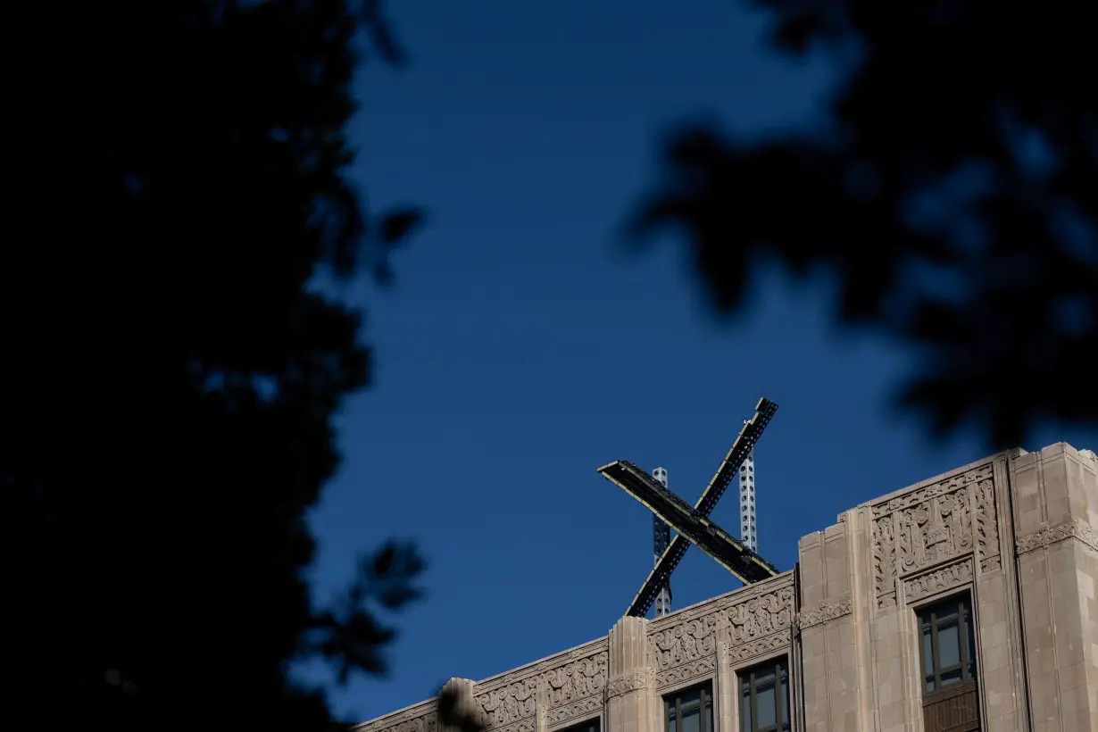 'X' logo is seen on the top of the headquarters of the messaging platform X, formerly known as Twitter in San Francisco