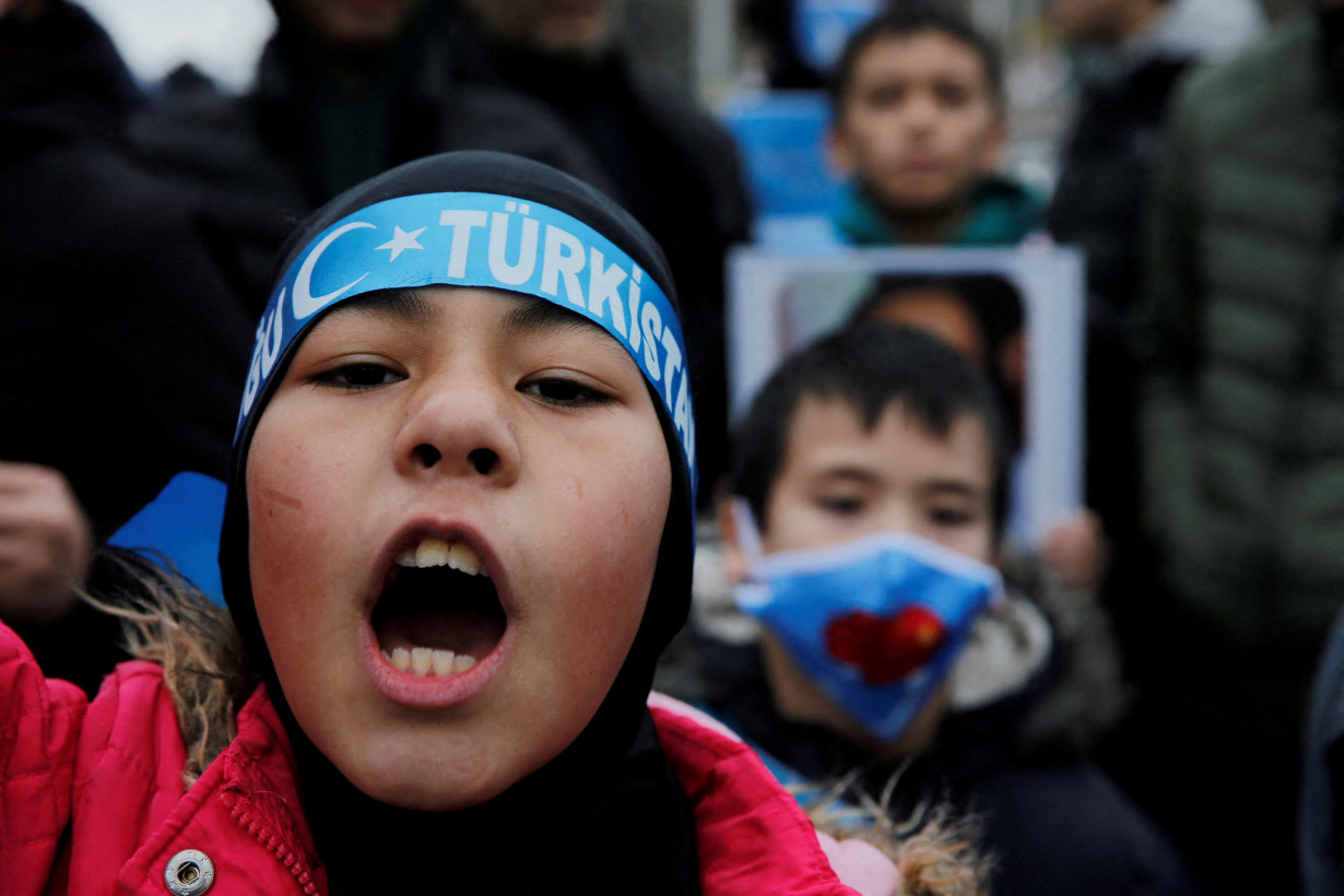 FILE PHOTO: Ethnic Uyghur demonstrators take part in a protest against China, in Istanbul