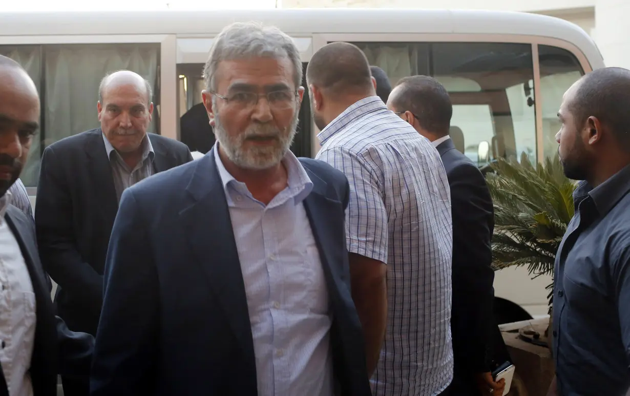 Ziad Al-Nakhala, Islamic Jihad's deputy leader, arrives at a hotel with other Palestinian negotiators after negotiations in Cairo