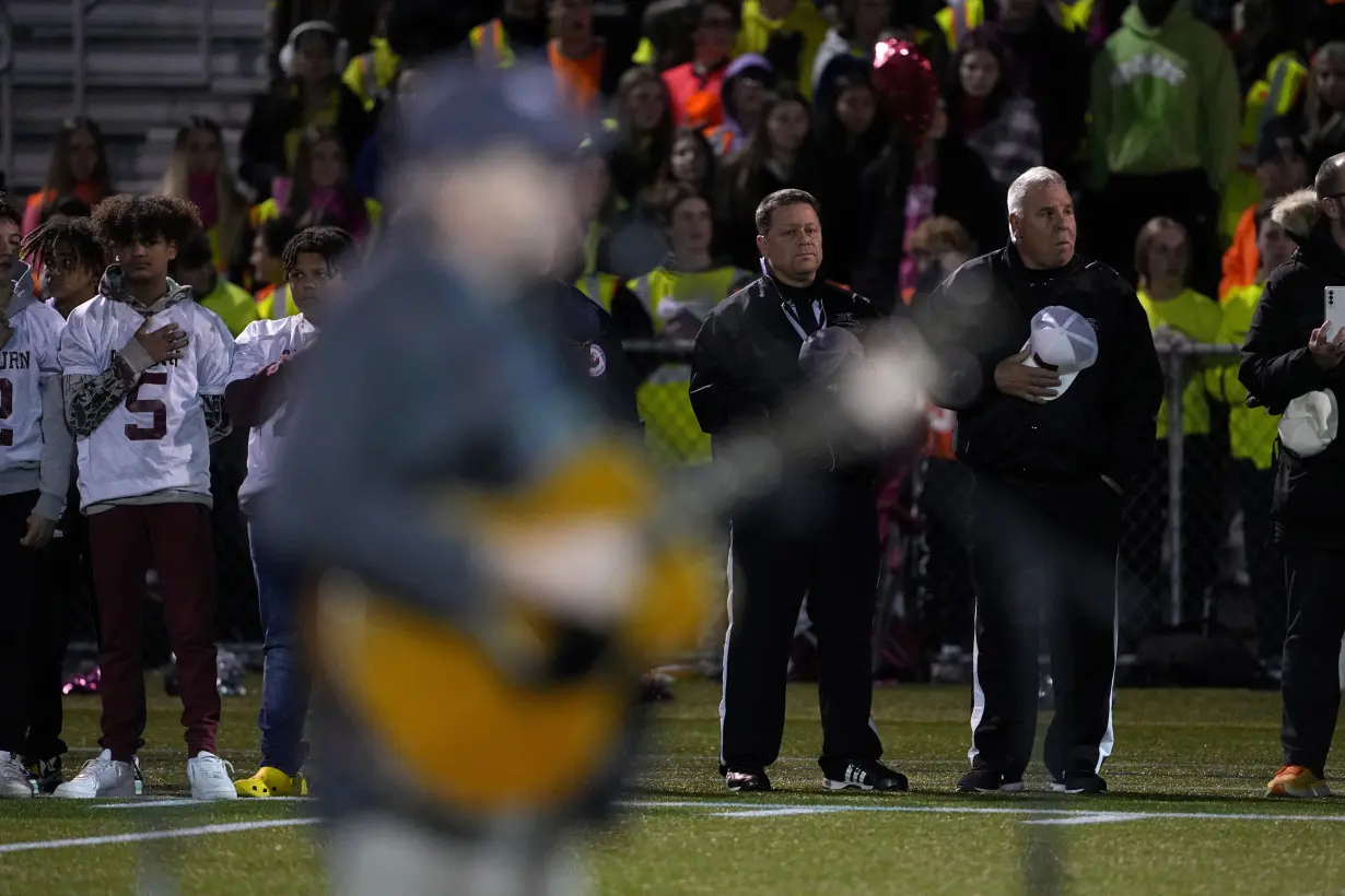 High school football rivals in Maine come together in emotional game after mass shooting