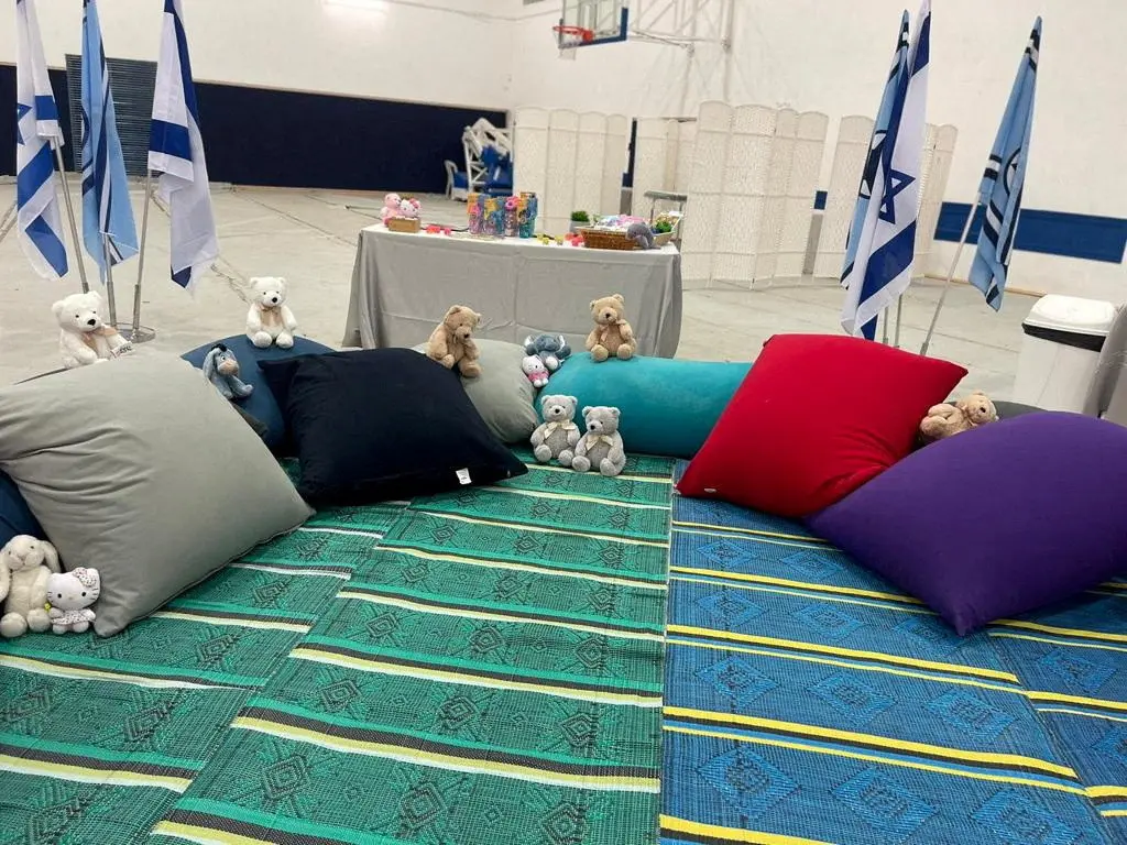 Stuffed animals and cushions await the arrival of children who have been held hostage in the Gaza Strip