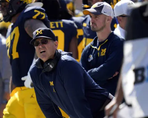 Coach Jim Harbaugh banned from 3 games over sign-stealing allegations. Michigan asks judge for stay