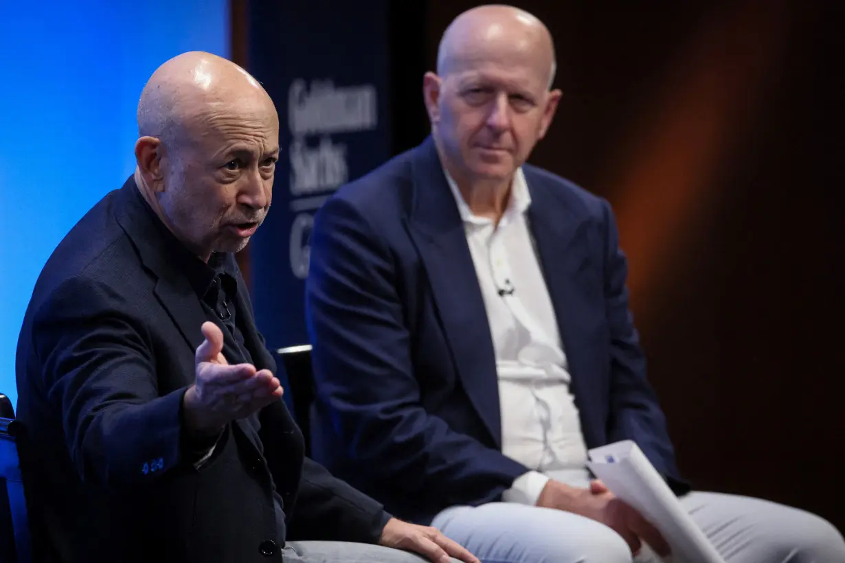 Goldman CEO and predecessor Blankfein talk careers as analysts compete