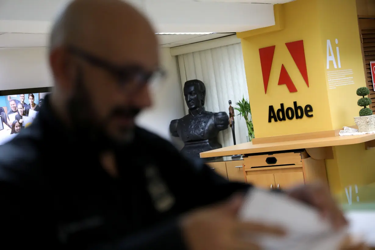 The corporate logo of software company Adobe is seen in Posa Studio school in Caracas