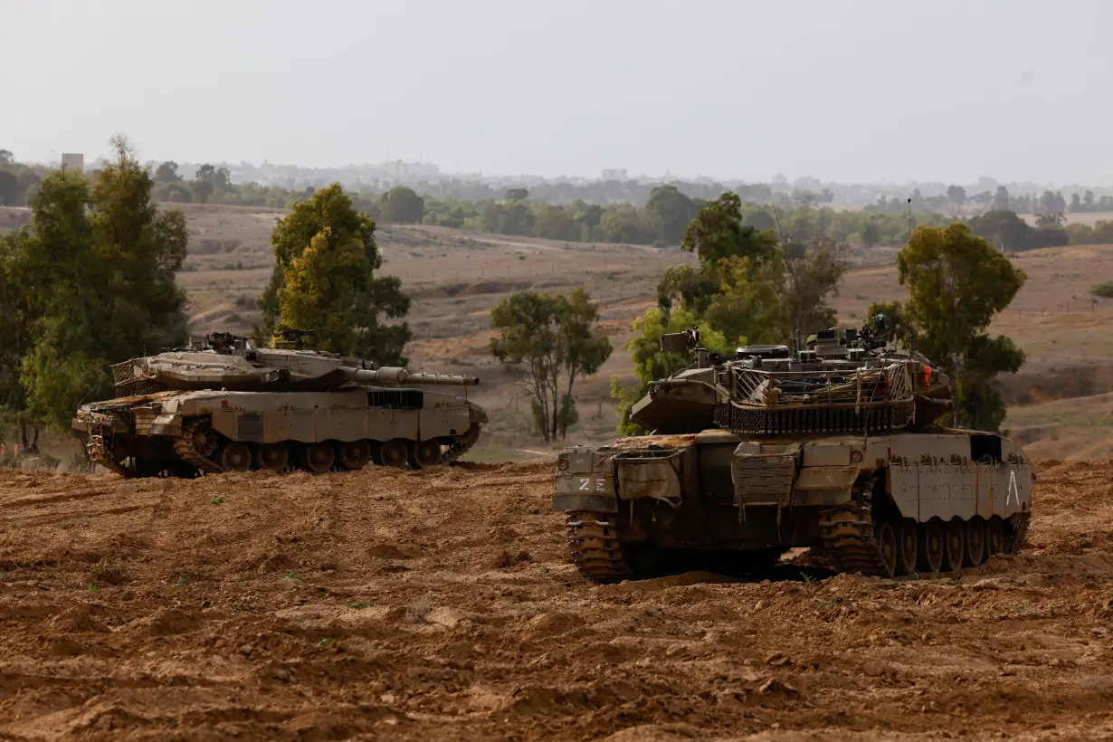 Israeli tanks take position near a border with Gaza