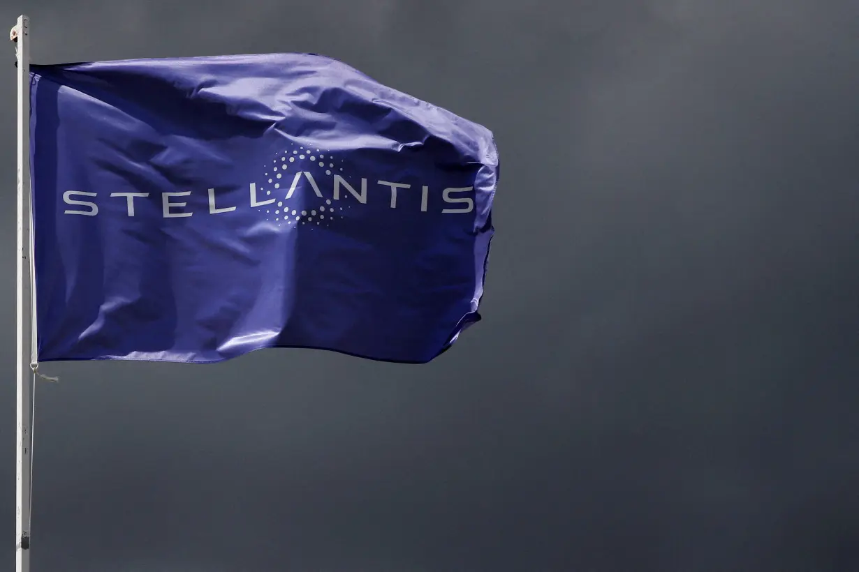 FILE PHOTO: A flag with the logo of Stellantis is seen near Paris