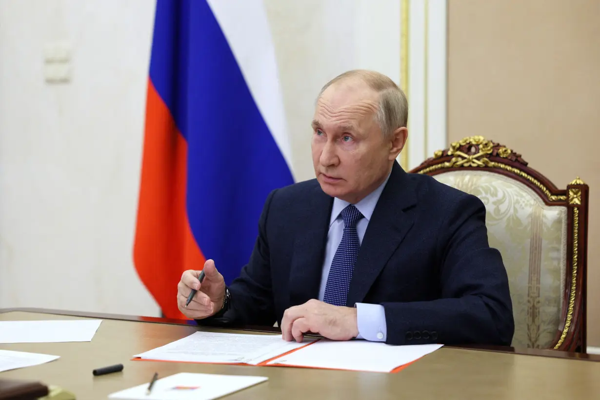 Russian President Vladimir Putin chairs a Security Council meeting in Moscow