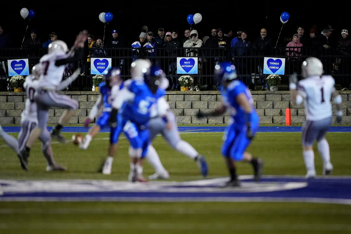 High school football rivals in Maine come together in emotional game after mass shooting