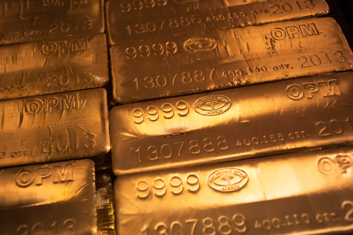 24 karat gold bars are seen at the United States West Point Mint facility in West Point, New York