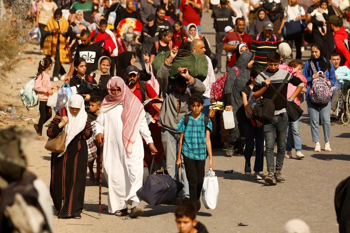 Palestinians fleeing north Gaza move southward, in the central Gaza Strip