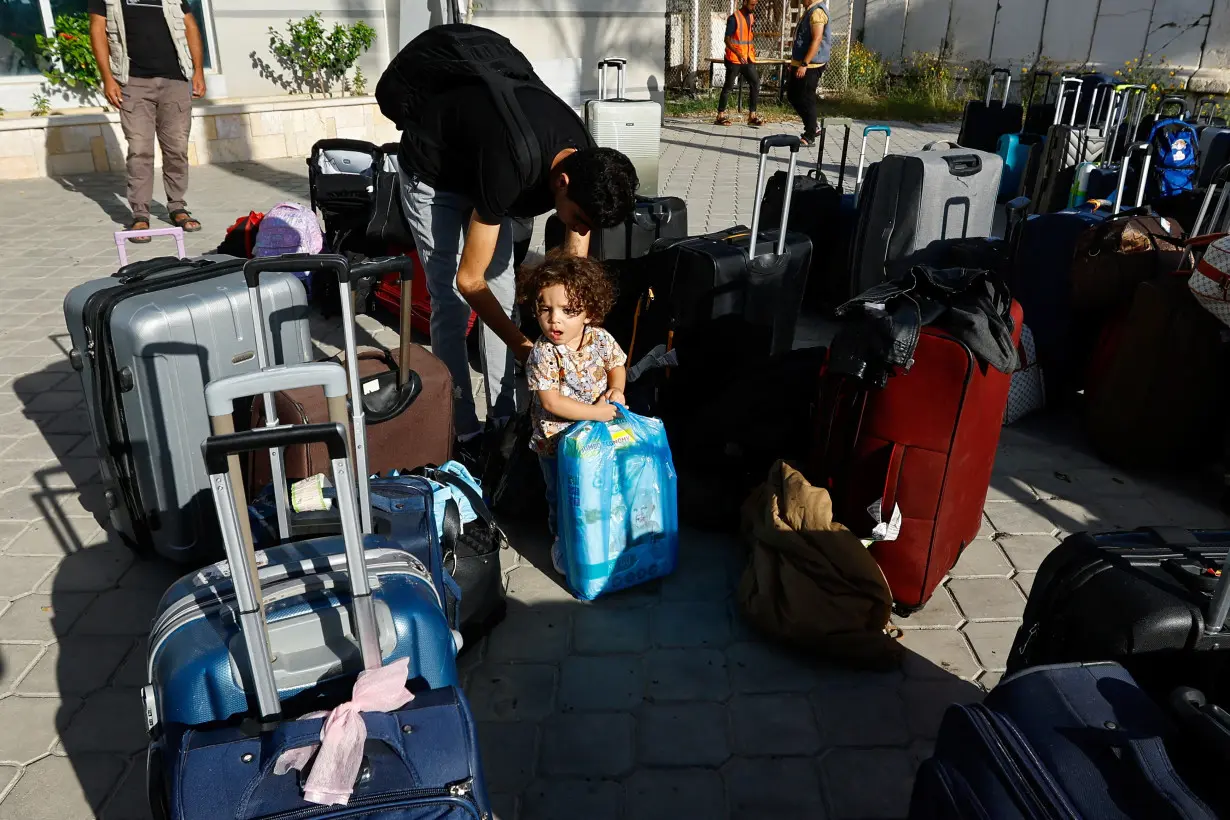 Palestinians with foreign passports wait for permission to leave Gaza