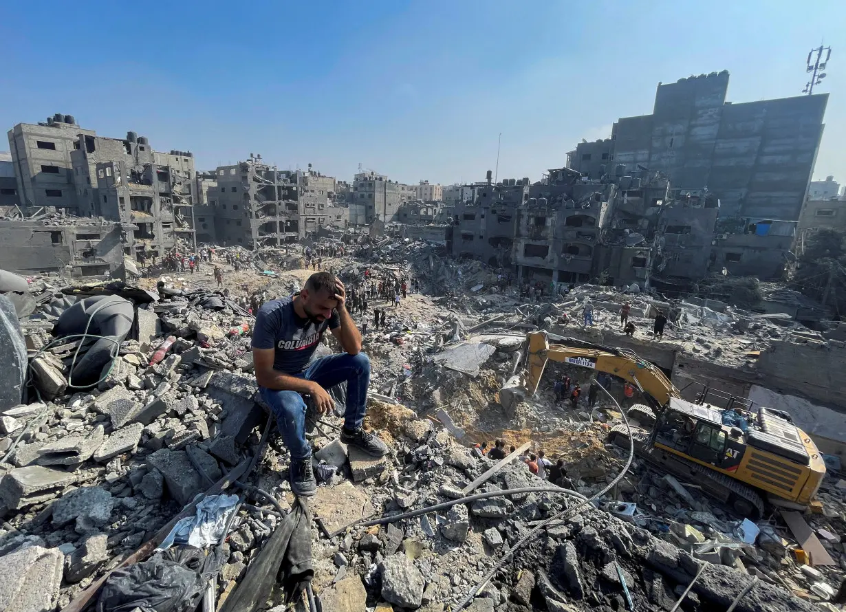 Palestinians search for casualties a day after Israeli strikes on houses in Jabalia refugee camp