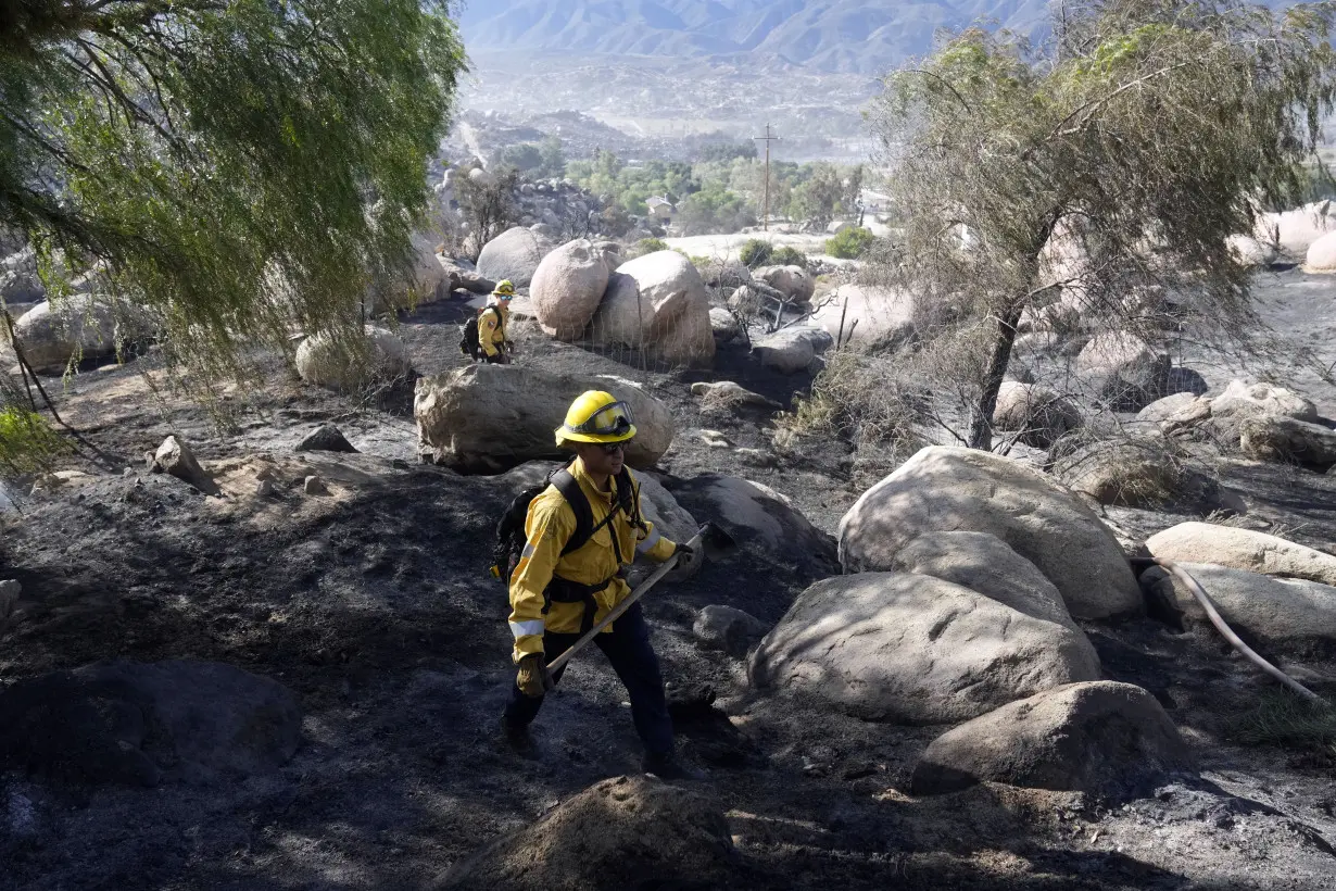 Firefighters make progress battling Southern California wildfire, but homes remain threatened